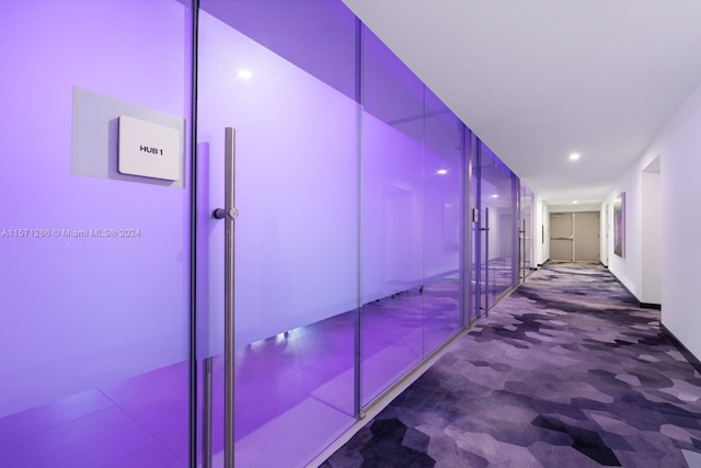 hallway with dark tile floors