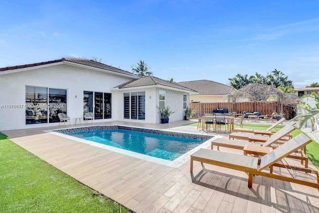 view of swimming pool featuring a patio