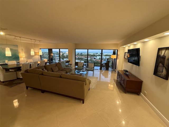 tiled living room featuring track lighting