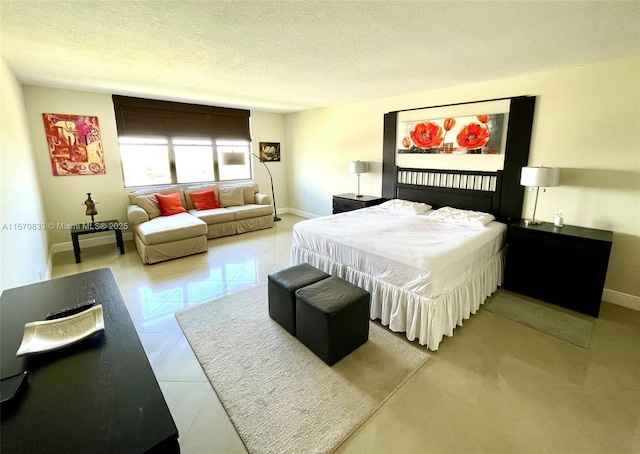 tiled bedroom with a textured ceiling