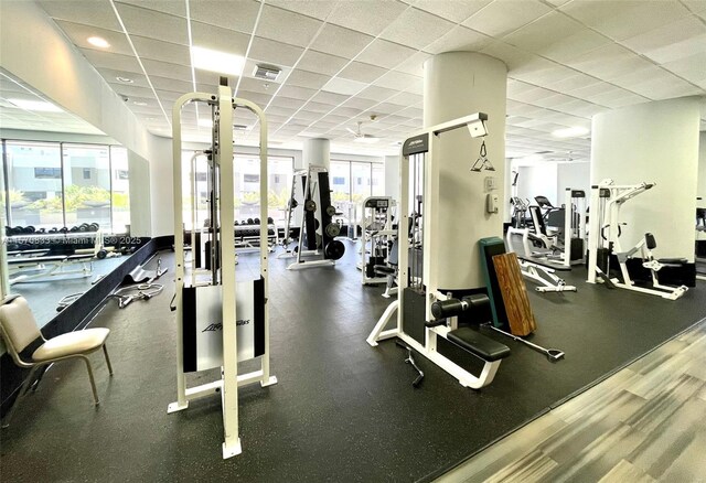 workout area with a paneled ceiling