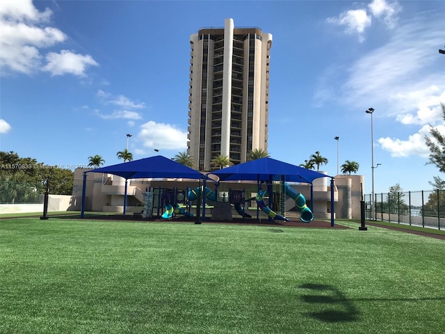 view of basketball court featuring a playground and a gazebo