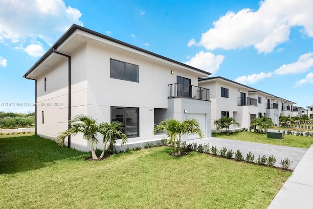 exterior space featuring a yard and a garage