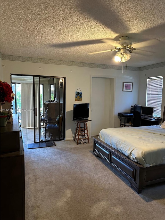 bedroom with a textured ceiling, ceiling fan, access to exterior, and carpet flooring