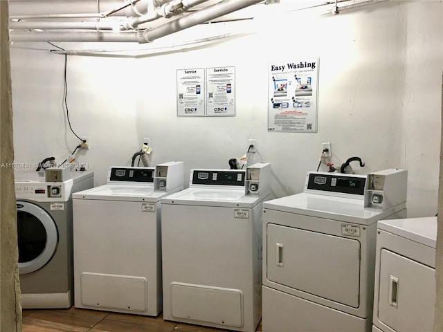 clothes washing area featuring separate washer and dryer