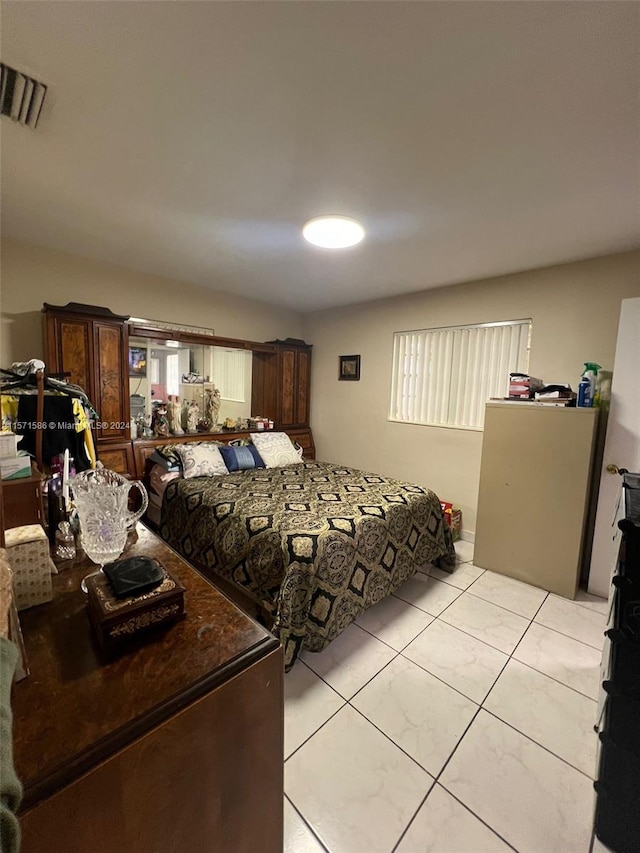 bedroom featuring light tile patterned floors