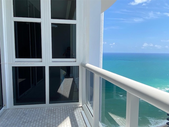 balcony featuring a water view