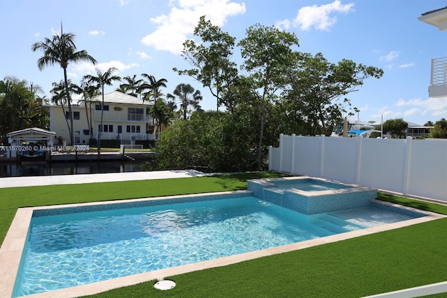 view of swimming pool with a water view and a lawn