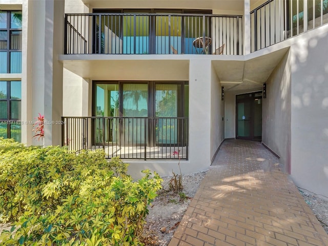 entrance to property with a balcony