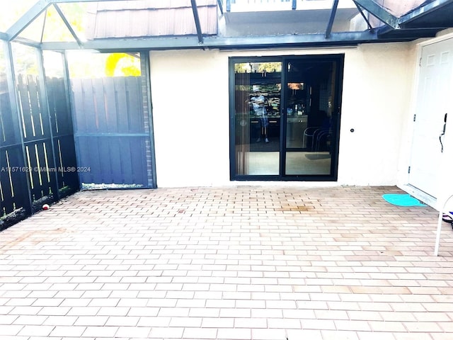 doorway to property featuring a patio