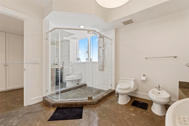 bathroom with toilet, a shower with door, and a bidet