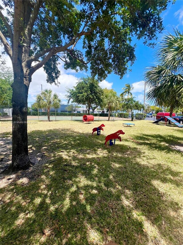 view of property's community with a yard