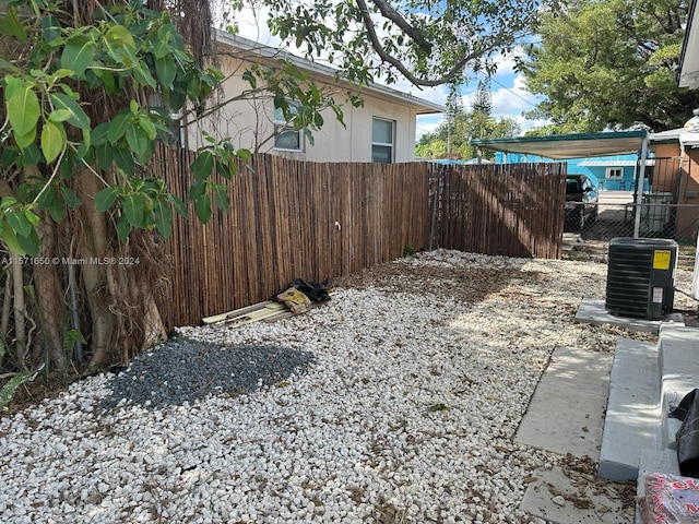 view of yard with central AC