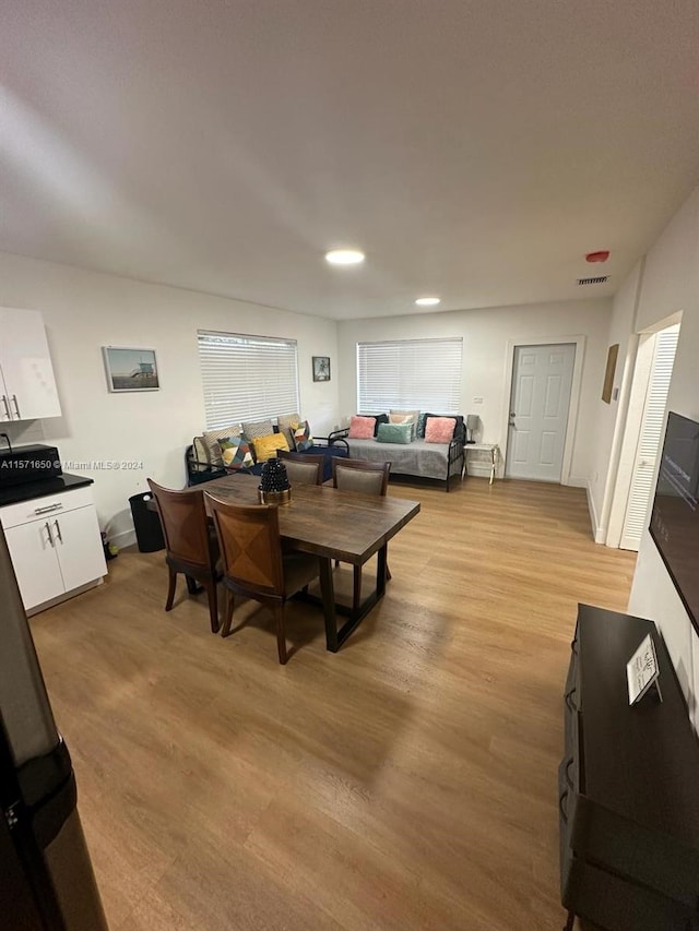 dining room with light wood-type flooring