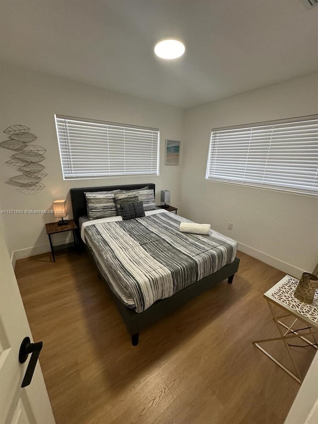 bedroom featuring dark hardwood / wood-style floors