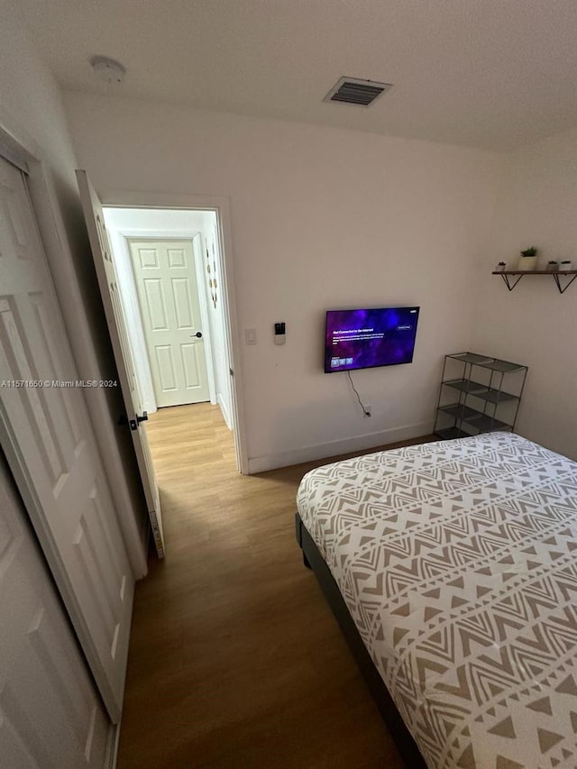 bedroom featuring light wood-type flooring