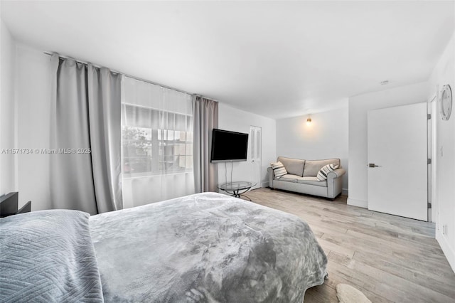 bedroom with light wood-type flooring