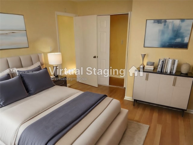 bedroom featuring a closet and light hardwood / wood-style flooring