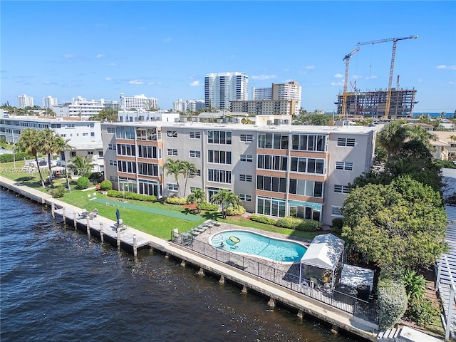 birds eye view of property with a water view