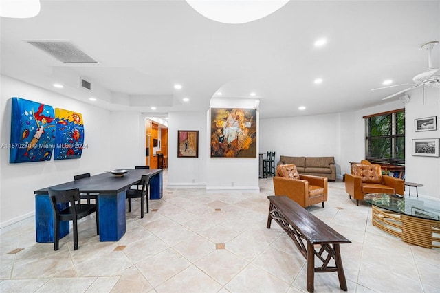 tiled living room featuring ceiling fan