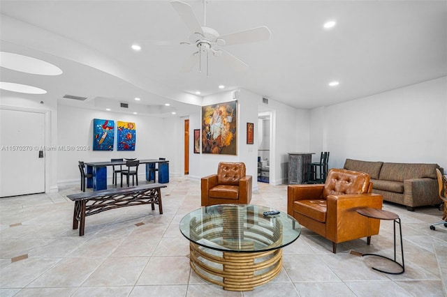 tiled living room featuring ceiling fan