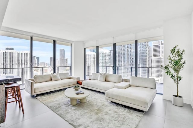 living area with a wall of windows and a city view