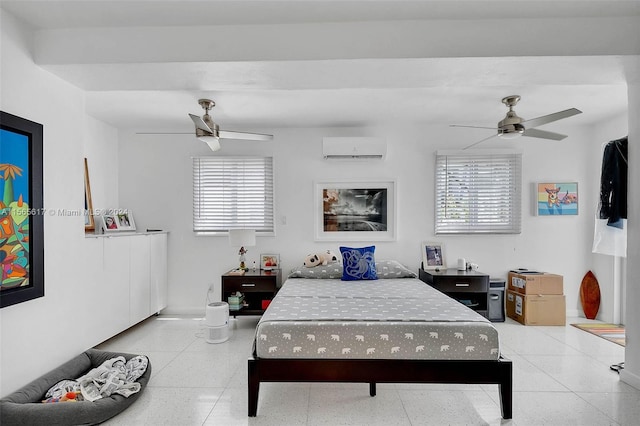 bedroom with ceiling fan, light tile floors, and an AC wall unit