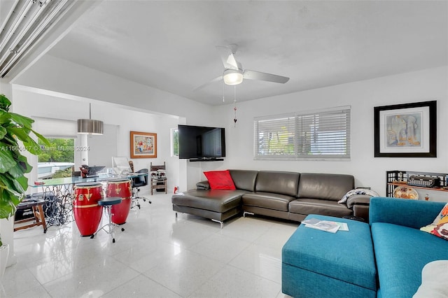 living room with ceiling fan and light tile floors