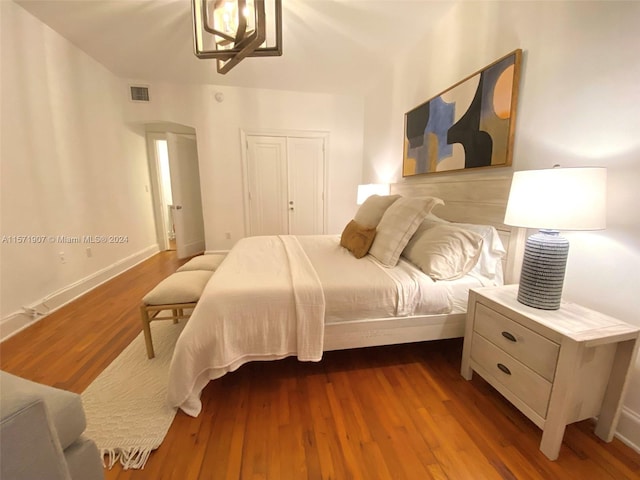 bedroom featuring a closet and dark hardwood / wood-style floors