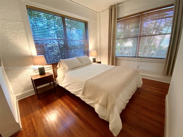 bedroom featuring dark hardwood / wood-style flooring