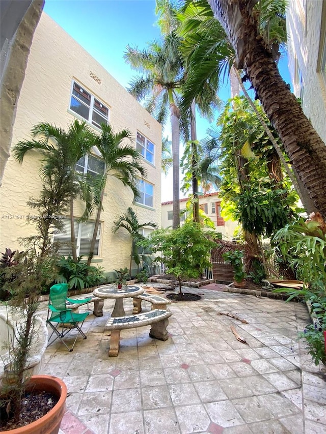 view of patio with a fire pit