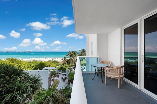 balcony featuring a water view