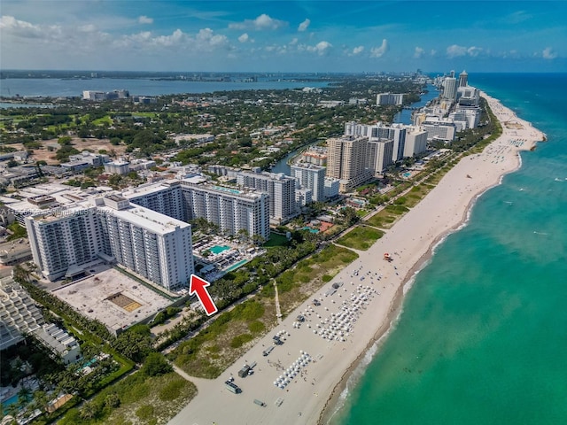 birds eye view of property featuring a water view and a view of the beach