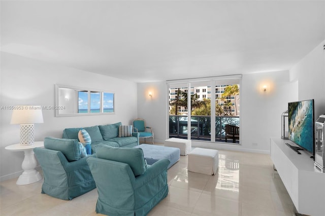 living room with a healthy amount of sunlight and light tile flooring