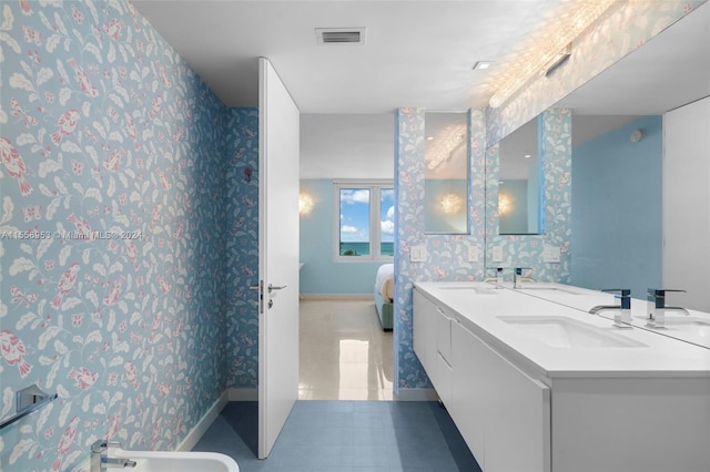 bathroom featuring dual bowl vanity, a bidet, and tile flooring