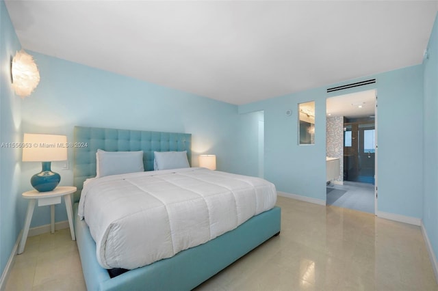 tiled bedroom featuring connected bathroom