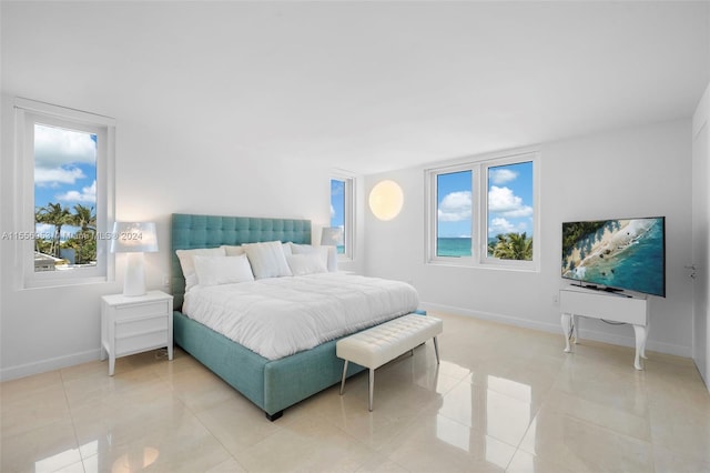 bedroom featuring light tile floors