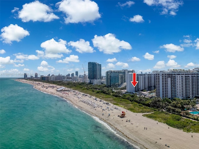 drone / aerial view with a view of the beach and a water view