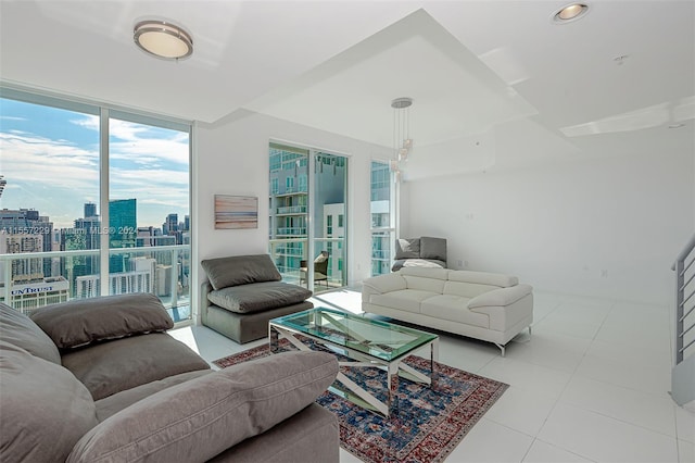 living room featuring a healthy amount of sunlight and light tile floors