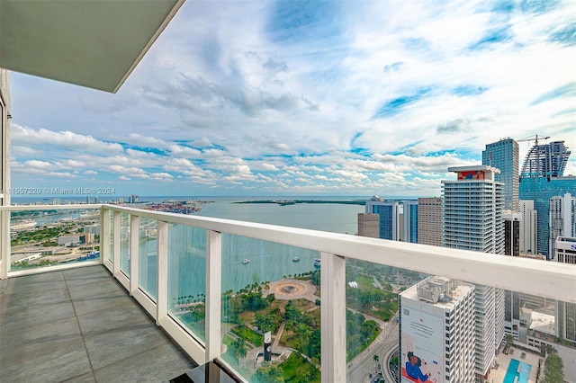 balcony featuring a water view