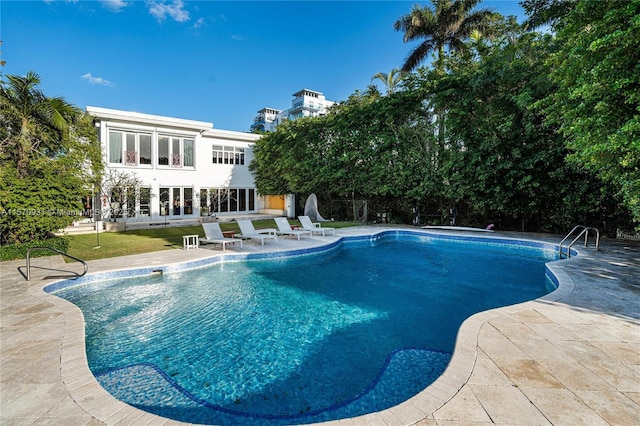 view of pool featuring a patio