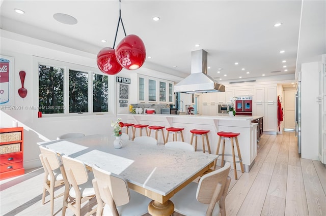 dining area with light wood-type flooring