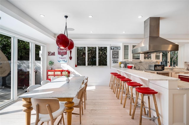 interior space featuring sink and light hardwood / wood-style floors