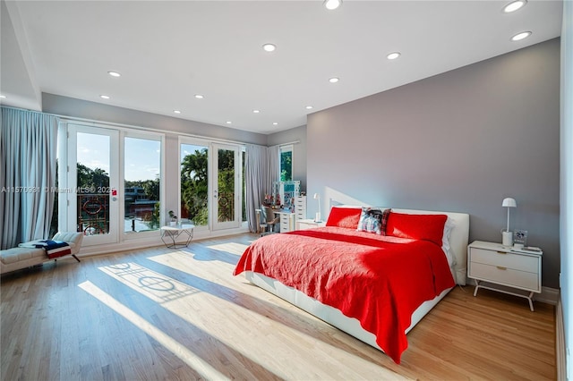 bedroom featuring hardwood / wood-style floors and french doors