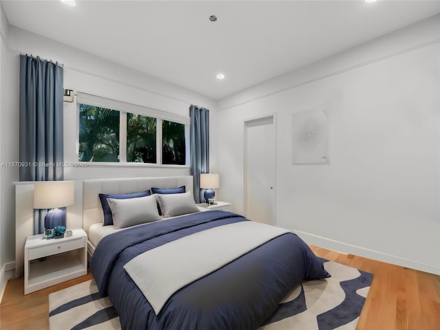 bedroom with hardwood / wood-style flooring