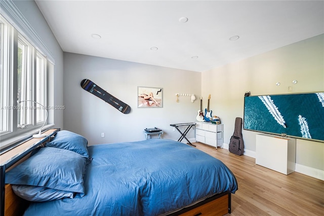 bedroom with wood-type flooring