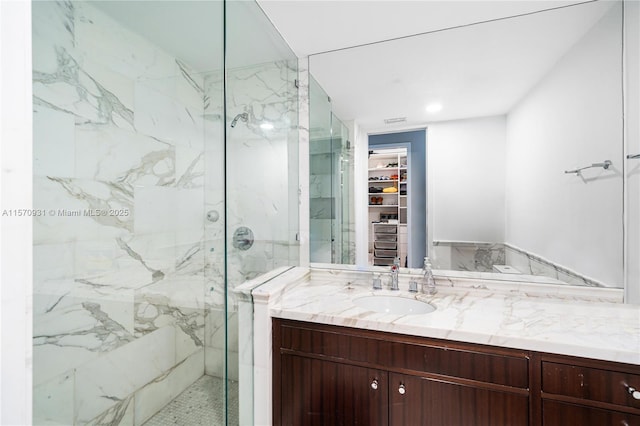 bathroom with vanity and an enclosed shower