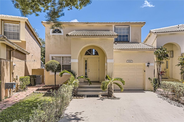 mediterranean / spanish house with a garage