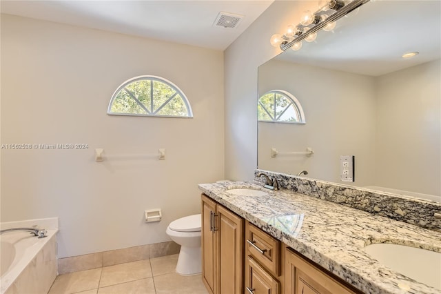 bathroom with dual bowl vanity, toilet, tile floors, and a bath