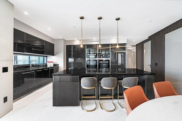 kitchen featuring a kitchen island, light tile flooring, a breakfast bar area, decorative light fixtures, and stainless steel oven